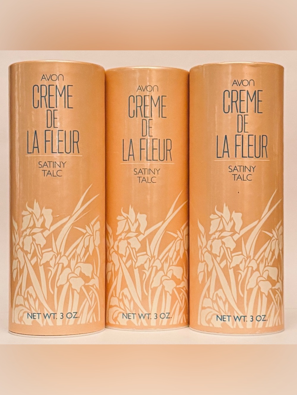 Three (3) vintage Avon Creme De La Fleur satiny body talcs